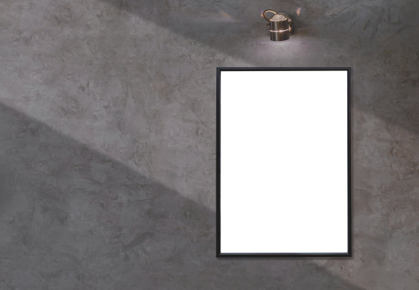 复古风格的阁楼水泥墙面上空白相框与壁灯的光影图片下载