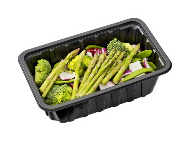 西兰花芦笋洋葱在一个塑料托盘上隔离白色图片下载