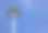 蓝色天空背景的圆形灯杆图片下载