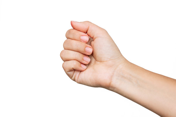 一个女人的手与干净健康整齐的指甲在一个白色的背景。经典的修指甲图片下载