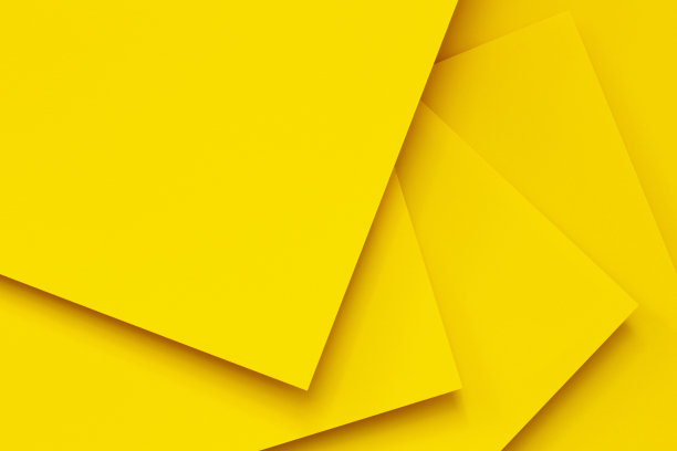 抽象单色创意纸纹理背景。最小几何黄色形状和线条。俯视图图片下载