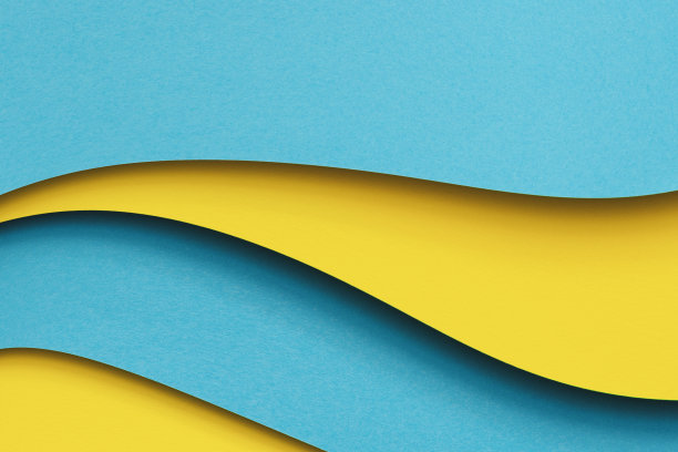 摘要彩色纸几何平铺组成背景。波浪形的蓝色，黄色的颜色线条背景。俯视图，复制空间图片下载