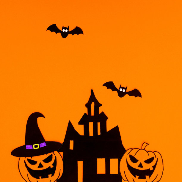 橙色背景与令人毛骨悚然的万圣节贴纸的创意排列。复制空间平铺图片下载