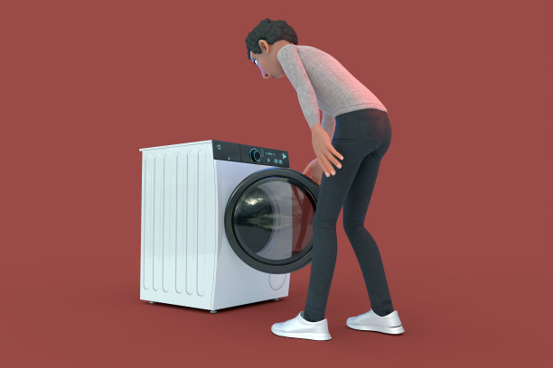 一个年轻人打开洗衣机的门图片下载