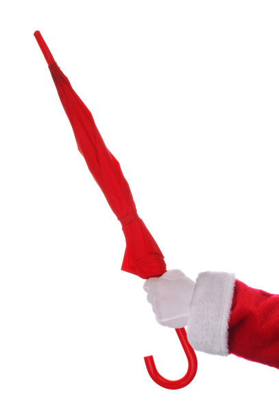 手持红色雨伞的圣诞老人图片下载