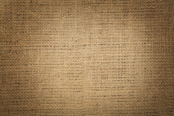 以天然粗麻布为背景，俯视图。装饰图案的效果图片下载