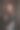 万圣节前夜，一个穿着女巫服装、画着骷髅妆的女人打开了一本女巫的黑色咒语书图片下载