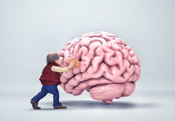 一个正在清理人类大脑的老人。心理健康与多巴胺概念。图片下载