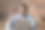 正戴着耳机的年轻男性对着笔记本电脑屏幕挥手图片下载