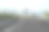 模糊空旷的柏油路和现代化的城市建筑图片下载