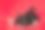 三只黑兔子坐在白色的圣诞玩具球中，红色的背景隔开。野兔是东历2023年的象征。新年的心情。节日卡片或证书。国家国旗的颜色图片下载