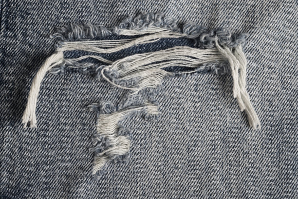 牛仔裤撕裂质感图片下载