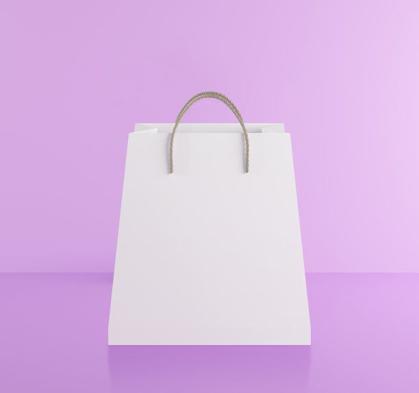 粉色背景的纸袋。购物配送理念图片下载