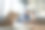 在开放式办公室工作的员工坐在笔记本电脑前的照片图片下载