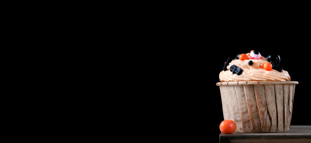 网页横幅与万圣节纸杯蛋糕与橙色奶油黑色图片下载