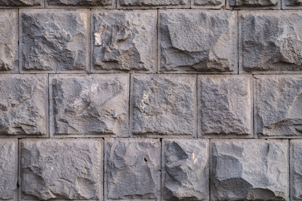 墙的纹理与粗糙的切割采石场面砌石灰渣图片下载