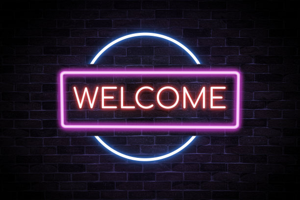 欢迎霓虹灯旗挂在枫叶上。图片下载