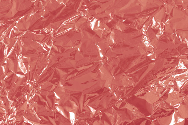 玫瑰金箔箔光泽的纹理，抽象的粉色包装纸作为背景和设计艺术作品。图片下载