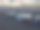 在犹他州东部沙漠地区70号州际公路上的一个大型停车场，半挂卡车排队等待晚上在一个戏剧性的云景日落天空下图片下载
