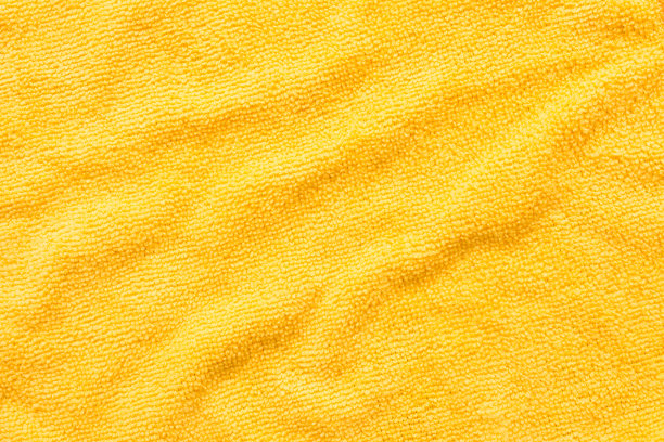 表面黄色超细纤维布，宏观纺织图案背景图片下载