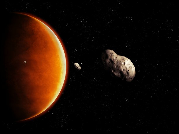 外太空的一组小行星以红色行星为背景图片下载