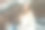 视频通话的概念。年轻的白人金发女学生坐在楼梯上微笑着对着屏幕挥手图片下载