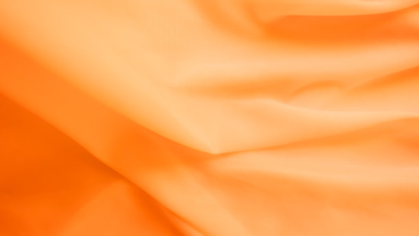 橙色的颜色布图案背景图片下载