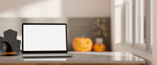 特写，现代工作空间在万圣节主题与笔记本电脑模型和复制空间在桌面上图片下载