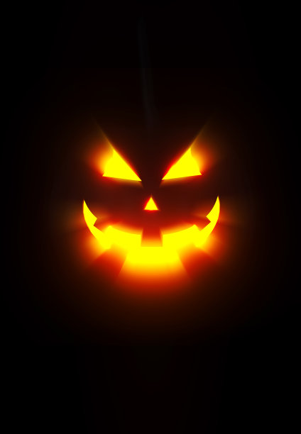 黑色背景下发光的橙色南瓜灯图片下载
