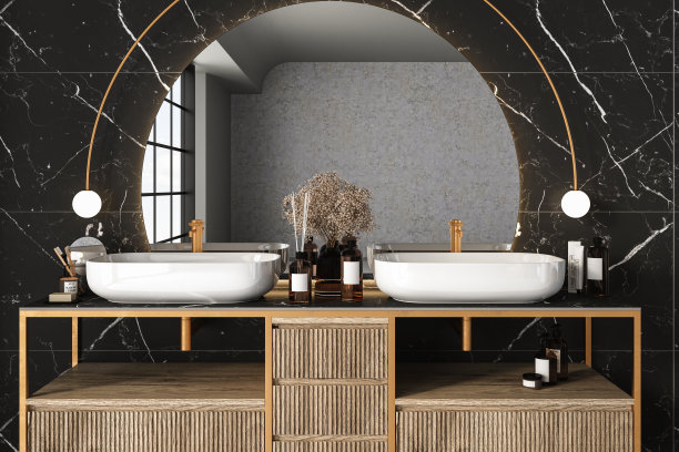 特写双水槽与椭圆形镜子挂在黑色大理石墙上图片下载