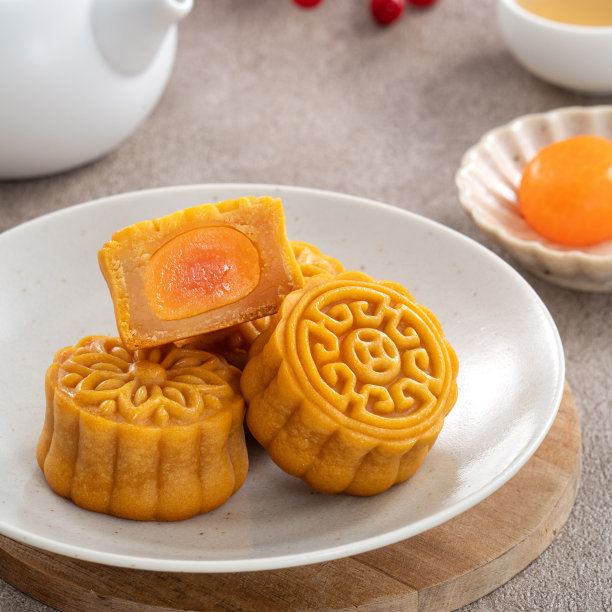 美味的广东月饼中秋食品月饼在灰色的桌子背景。图片下载