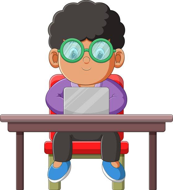 男孩正坐着认真地在笔记本电脑上工作图片下载