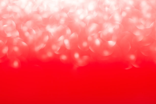 红色模糊抽象背景与散焦光。与散景效果。圣诞节，新年，情人节和国际妇女节，生日，3月8日。本空间图片下载