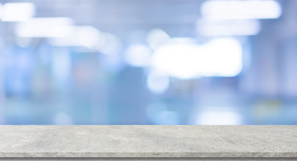 摘要模糊的现代医院内部背景，用混凝土纹理的桌面来展示和推广所展示的内容或产品图片下载