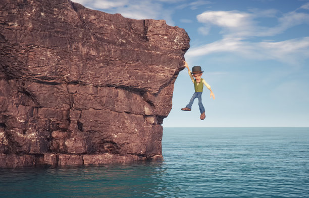 人在海面上的岩石上。图片下载