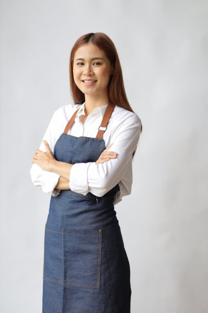 亚洲女企业家，白底围裙。图片下载
