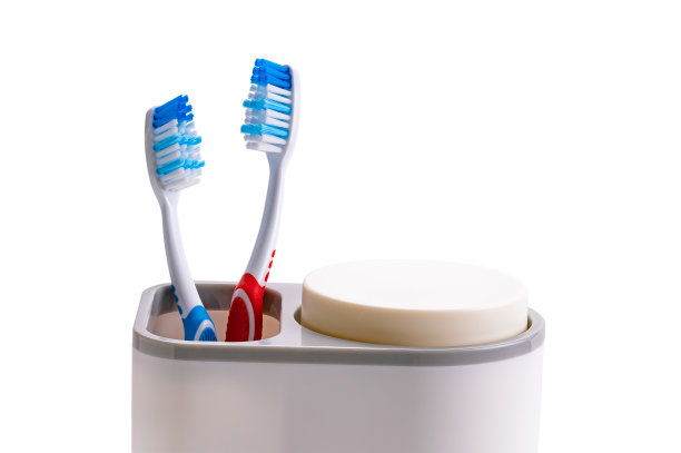 新牙刷红色和蓝色手柄塑料支架。图片下载