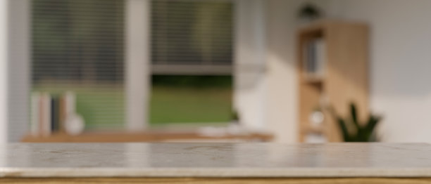 复制空间在大理石桌面上模糊的最小客厅的背景。图片下载