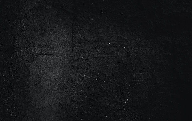 岩石表面有裂缝。黑色的纹理。石头的背景。黑暗的大理石。岩石纹理。岩石堆。墙漆点。枯燥乏味的粗糙结构。抽象的纹理。图片下载