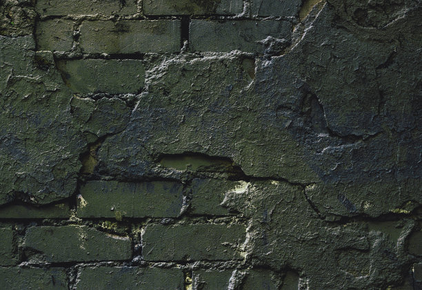 岩石纹理。砖绿石墙。石头的背景。石材质感的设计师。墙的抽象。油漆斑点。岩石表面有裂缝。抽象的纹理。图片下载