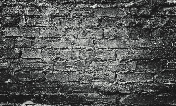 砖银墙。岩石背景。岩石纹理。黑色的纹理。石头的背景。岩石堆。黑油漆斑点。岩石表面有裂缝。枯燥乏味的粗糙结构。抽象的纹理。图片下载