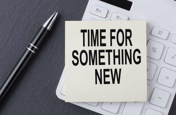 文字时间为一些新的东西贴纸上的计算器，商业概念图片下载