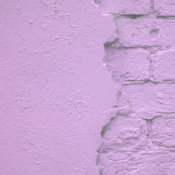 半抹灰灰泥半砌体砖粉紫色的石墙抽象背景为平面设计师图片下载
