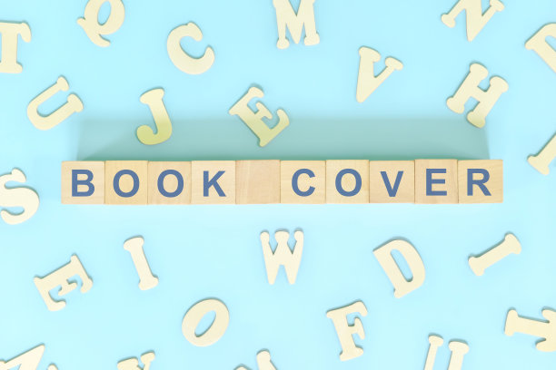 书的封面部分的书的概念。木块排版字平铺在蓝色背景。图片下载
