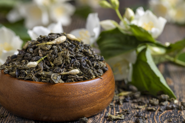 桌上放着茉莉花的真正的绿色时光图片下载