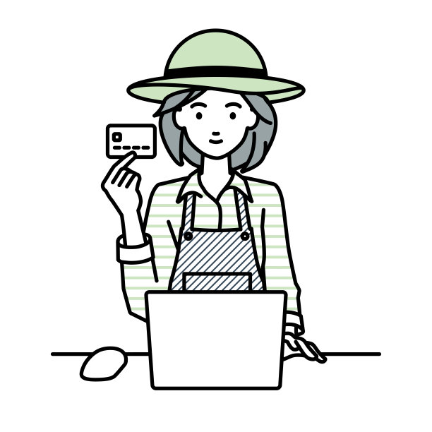 一位农妇在她的办公桌前使用笔记本电脑，手里拿着一张信用卡图片下载