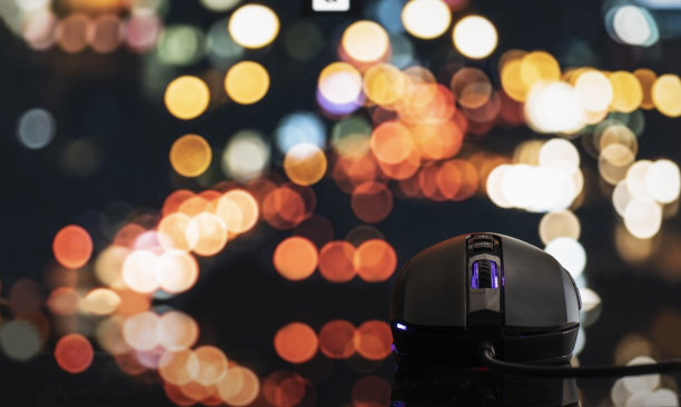 黑色电脑鼠标与散景背景图片下载