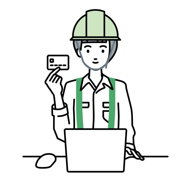 一名在建筑工地工作的妇女在办公桌上使用笔记本电脑，手里拿着信用卡图片下载