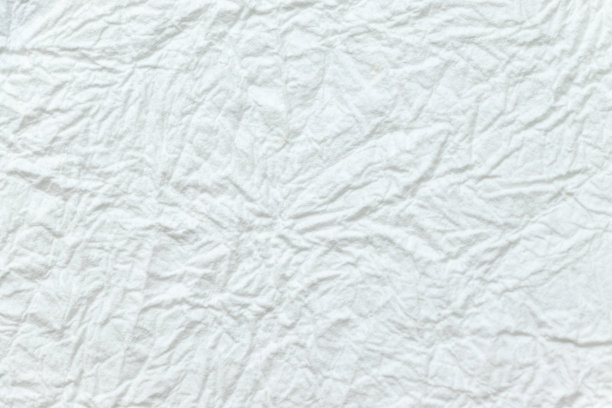 皱巴巴的白纸表面图片下载