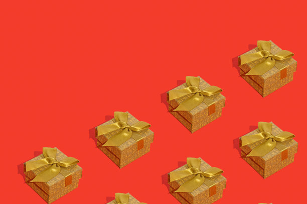 红色背景的金色圣诞礼品盒图案。新年呈现概念。图片下载